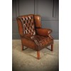 Pair of Hand Dyed Brown Buttoned Leather Wing Chairs 